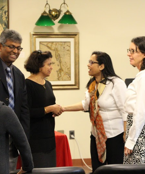 Attendees shaking hands