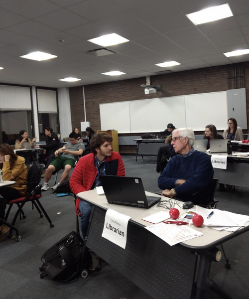 Librarian Chris Filstrup working with student