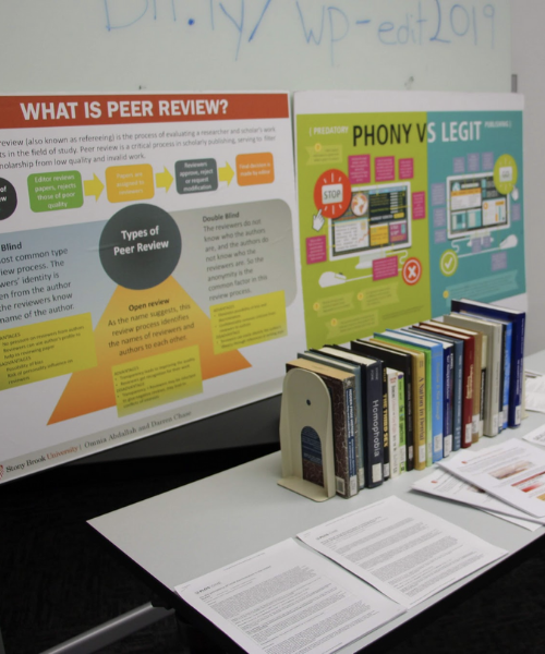 Poster boards and books on display for the Editathon