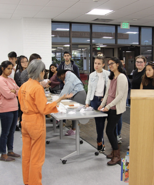 Professor Nobi Nagasawa explaining the project to students