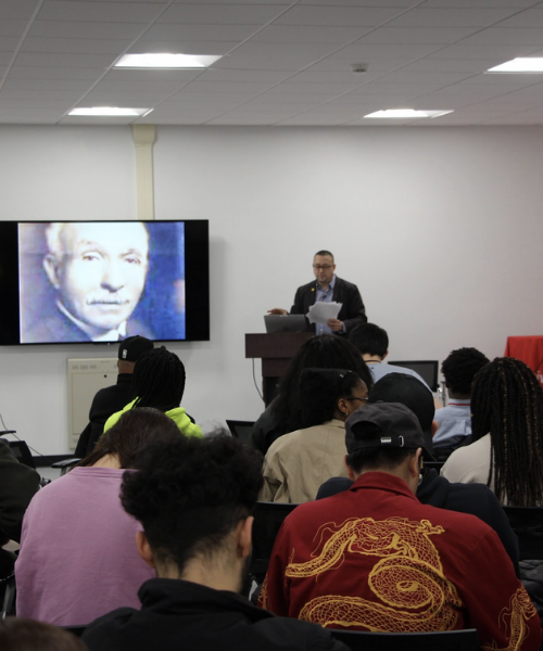 Dr. Zebulon Miletsky in front of room speaking to students