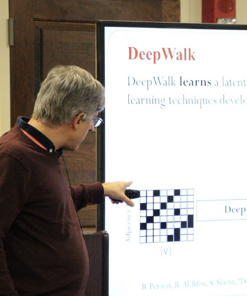 Dr. Steven Skiena pointing to slides