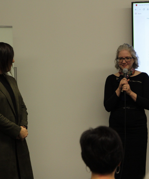 Dr. Margaret Schedel speaking to group of attendees at launch